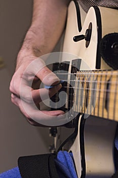 Vertical perspective guitar practice under the dim light