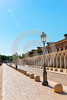 Vertical photo in color of a path around the palatial building, House of the infants of Aranjuez.