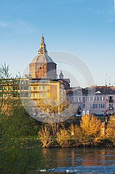 Vertical photo of covered bridge and Pavia cathedral at sunny day