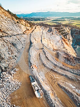 Vertical photo of gravel roads on the side of the open pit quarry