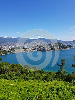 Vertical photo of the port of Acapulco taken from La Roqueta Island photo