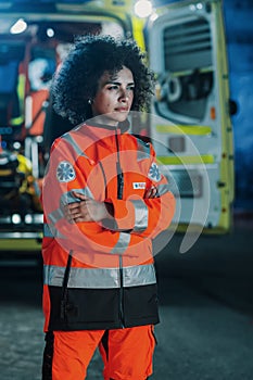 Vertical Photo: Portrait of Beautiful, Multiethnic, Female Paramedic Specialist on Late Night Shift