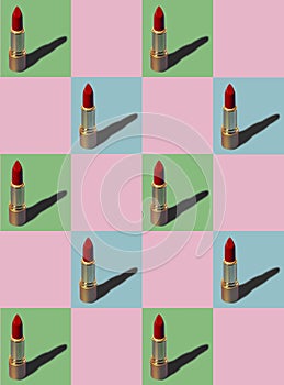 Vertical photo of red and gold lipstick chess pattern repeating pattern on pastel blue, green and pink background