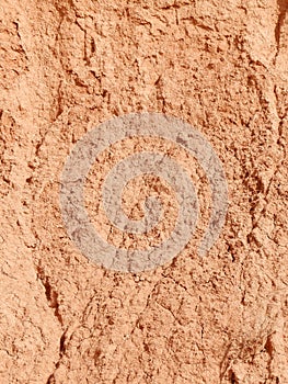 Vertical photo of red soil texture. Earth pattern. Background, copy space