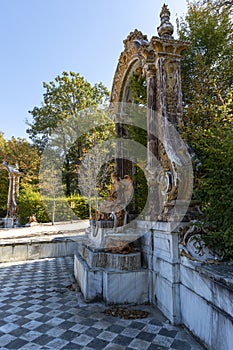 Vertical photo of the side of a statue in the gardens photo