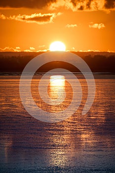 A vertical photo of a sunset at Pegwell Bay, Thanet, Kent