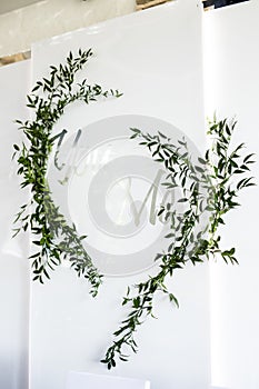 Vertical photo of wedding photozone with green grass and with two words