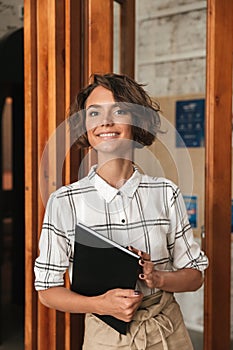 Vertical picture of Business woman with folder in hand