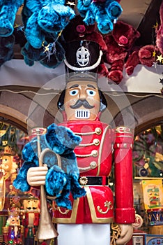 Vertical picture of christmas decoration on new year market in Alsace, France. Nutcracker and a lot of blue and red bears. Colmar