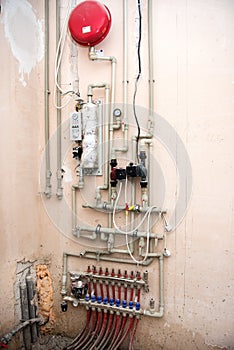Vertical picture of heating system of the house. Manifold, collector for heating of a floor. Boiler room equipment