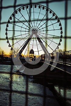 Vertical picture of the Montreal Ferris Wheel at the Old Port during the sunset in Canada