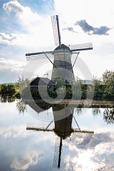 Vertical picture of one of the famous Dutch windmills at Kinderdijk, a UNESCO world heritage site. On the photo is one