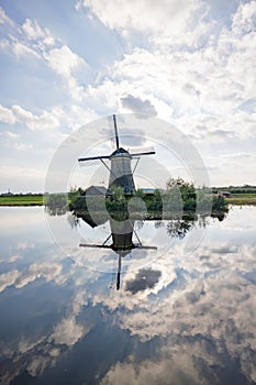 Vertical picture of one of the famous Dutch windmills at Kinderdijk, a UNESCO world heritage site. On the photo is one