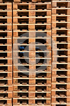 Stacks of wooden cargo shipping pallets.