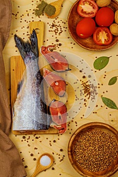 In the vertical picture, tomatoes, buckwheat and frozen pink salmon