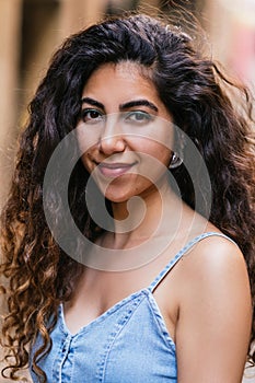 vertical portrait of a beautiful turkish woman in the street