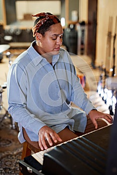 Musician Playing Keyboards in Studio