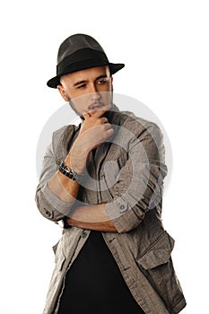 Vertical portrait of glamour young man in hat and jacket looking