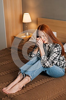 Vertical portrait of sad woman crying and wiping tears with handkerchief, suffering from bad relationship, feeling