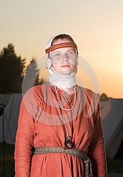 Vertical portrait of a Slavic woman in historical costume. The image of a woman from the past