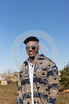 vertical Portrait of smiling man wearing sunglasses