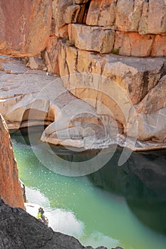 Vertical or portrait view of river going through desert oasis in Payson, Arizona along hiking trail in Tonto National Forest