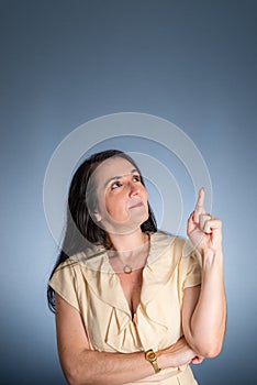 Vertical portrait of young businesswoman, lawyer, showing her business folder