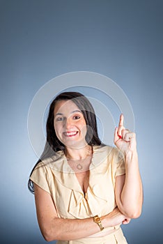 Vertical portrait of young businesswoman, lawyer, showing her business folder