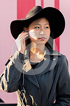 Vertical portrait of a young classy asian woman