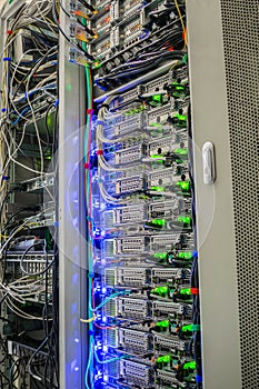 Vertical racks with modern computer equipment are in the server room datacenter. Technical site of the telecommunication Internet