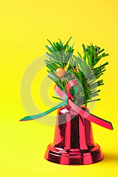 Vertical Red Christmas bells on a yellow background