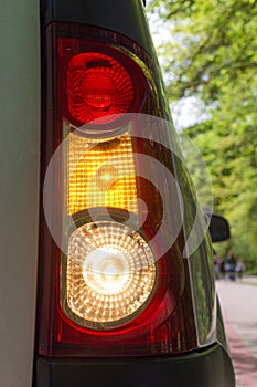 Vertical red and yellow taillight with blinker.