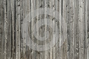 Vertical and rustic gray wood plank barn wall Quebec Canada