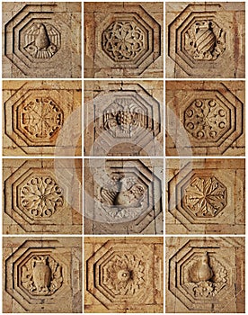 Vertical of a set of old Armenian ornaments on stone