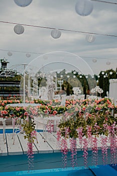 Vertical shallow focus shot of an outdoor wedding ceremony reception decorations