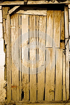 Vertical sho of an antique wooden door of a village house