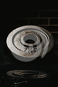 Vertical shot of a 1 kg metal plate