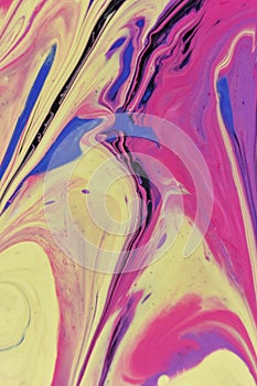 Vertical shot of an abstract background of colorful acrylic paint and oil liquid mixture