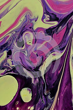 Vertical shot of an abstract background of colorful acrylic paint and oil liquid mixture