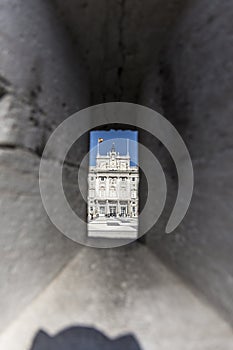 Vertical shot of an ancient building through the hole