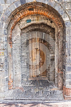 Vertical shot of an arch door in an ancient building in China