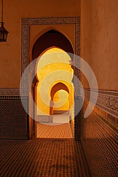 Vertical shot of the arches in Mausoleum of Moulay Ismail interior in Meknes in Morocco