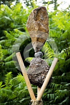 Vertical shot of a balanced rocks artwork from granite and larvikite