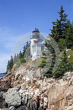 Vertical shot of the Bass Harbor Head Lighthouse in Tremont, USA, under the blue sky