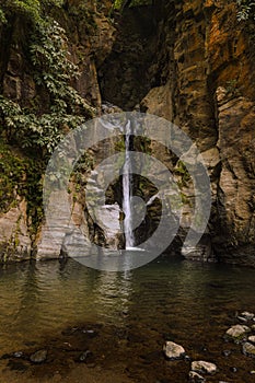Vertical shot of the beautiful Salto do Cabrito Waterfall in Azores photo