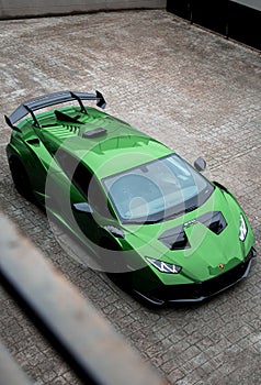 Vertical shot of a beautiful sleek luxurious Lamborghini Huracan Sto parked outdoors