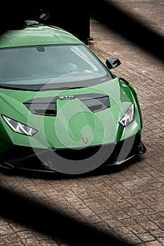 Vertical shot of a beautiful sleek luxurious Lamborghini Huracan Sto parked outdoors