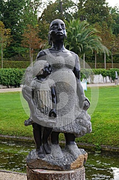 Vertical shot of a beautiful stone sculpture of mother and daughter in Schwetzingen, Germany