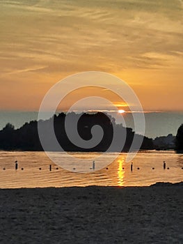 Vertical shot of beautiful sunset over the Zevenhuizerplas Lake in the Netherlands