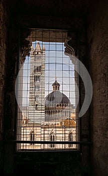 Vertical shot of the bell tower of the Siena cathedral from inside a building, Italy